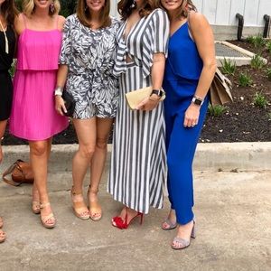 Striped tie-front dress with plunging neckline and keyhole back. 38" from waist